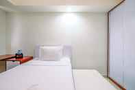 Bedroom Classic and Minimalist Studio at Evenciio Margonda Apartment By Travelio