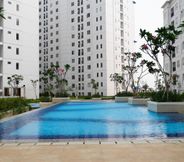 Swimming Pool 6 Comfort Living and Best Choice 2BR Bassura City Apartment By Travelio