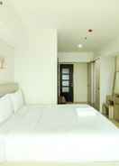 BEDROOM Spacious Combine 2BR Apartment at Tamansari La Grande By Travelio