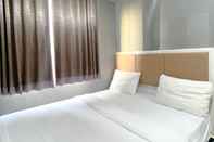 Bedroom Best Strategic and Homey 2BR Apartment at Bassura City By Travelio
