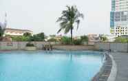 Swimming Pool 5 Cozy Living Studio at Margonda Residence 1 Apartment By Travelio