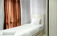 Bedroom 2 Restful and Modern Look 2BR Vasanta Innopark Apartment By Travelio