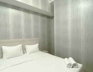 Bedroom 2 Restful and Modern Look 2BR Vasanta Innopark Apartment By Travelio