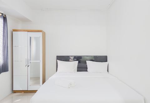 Bedroom Well Furnished with Cozy Designed Studio Apartment Urbantown Serpong By Travelio