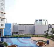 Swimming Pool 5 Homey and New 2BR Apartment at Suncity Residence By Travelio