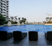 Swimming Pool 7 Minimalist and Great Choice 2BR West Vista Apartment By Travelio