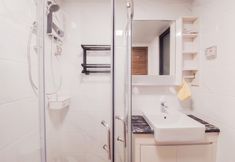 In-room Bathroom 3 Comfy 3BR Apartment Sky House BSD By Travelio