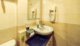 In-room Bathroom 6 Strategic and Best Choice 2BR Apartment at Grand Setiabudi By Travelio