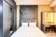 Bedroom Comfy Studio at Delft Ciputra Makassar Apartment By Travelio