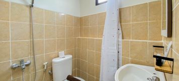 In-room Bathroom 3 Cozy Living Studio Apartment at Kebagusan City By Travelio