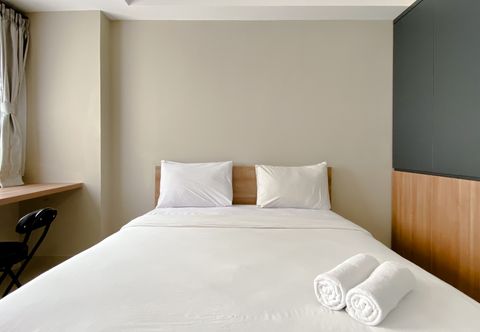 Bedroom Cozy and Good Choice Studio Gateway Park LRT City Bekasi Apartment By Travelio