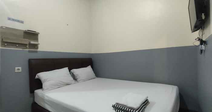 Kamar Tidur Puspiptek Residence Syariah Mitra RedDoorz