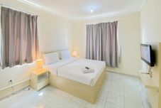 Kamar Tidur Cozy Stay Studio Room Apartment Grand Palace Kemayoran By Travelio