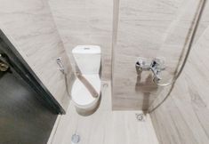 In-room Bathroom 3 Homey and Cozy Living Studio Apartment at Collins Boulevard By Travelio