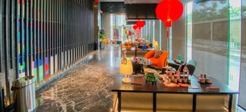 Lobby 6 Homey and Cozy Living Studio Apartment at Collins Boulevard By Travelio