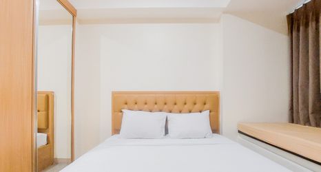 Bedroom 2 Homey and Cozy Living Studio Apartment at Collins Boulevard By Travelio