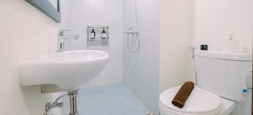 In-room Bathroom 3 Cozy and Restful Studio Apartment LRT City Sentul - Royal Sentul Park By Travelio