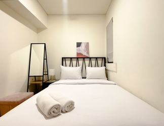 Bedroom 2 Clean and Homey 2BR Apartment at Meikarta By Travelio