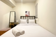 Bedroom Clean and Homey 2BR Apartment at Meikarta By Travelio