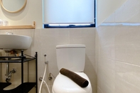 In-room Bathroom Clean and Homey 2BR Apartment at Meikarta By Travelio