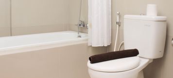 In-room Bathroom 3 Nice and Comfy Studio Apartment Azalea Suites By Travelio