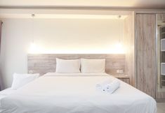 Bedroom 2 Minimalist and Comfort Studio at Amethyst Apartment By Travelio