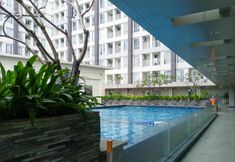 Swimming Pool 5 Cozy Designed Studio Apartment at Taman Melati Sinduadi By Travelio
