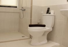 In-room Bathroom 7 Minimalist and Cozy 3BR Apartment at Meikarta By Travelio