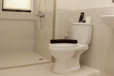 In-room Bathroom Minimalist and Cozy 3BR Apartment at Meikarta By Travelio
