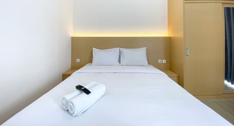 Bedroom 2 Comfort and Simply Design Studio Apartment at Vasanta Innopark By Travelio