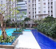 Swimming Pool 5 Cozy Living Studio Apartment at Green Bay Pluit By Travelio