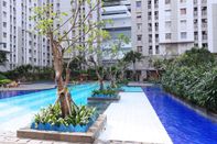 Swimming Pool Cozy Living Studio Apartment at Green Bay Pluit By Travelio