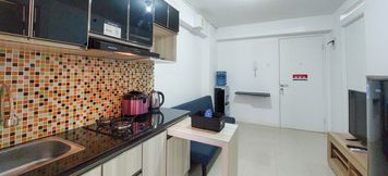 Lobby 4 Comfortable and Warm 2BR Apartment at Bassura City By Travelio