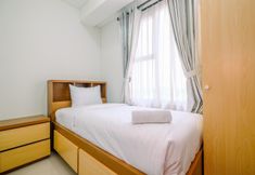 Bedroom 2 Cozy 2BR Apartment Transpark Cibubur near Mall By Travelio