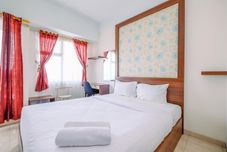 Bedroom Warm and Cozy Studio Apartment at Margonda Residence 3 By Travelio