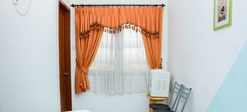 Bedroom 2 Homey Studio at Margonda Residence 1 Apartment By Travelio