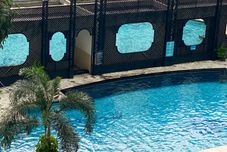 Swimming Pool Good Place 2BR Bellagio Residence Apartment By Travelio