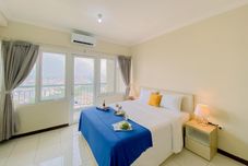 ห้องนอน Warm and Cozy Studio (No Kitchen) at Grand Palace Kemayoran Apartment By Travelio