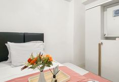 Bedroom 2 Homey and Good Place 2BR Bassura City Apartment near Mall By Travelio