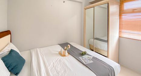 Bedroom 2 Modern and Best Choice 2BR Green Pramuka City Apartment By Travelio