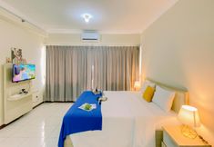 Phòng ngủ 3 Pleasant and Warm Studio (No Kitchen) at Grand Palace Kemayoran Apartment near JIEXPO By Travelio