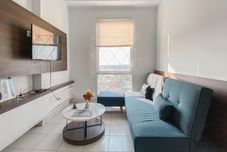 Common Space Restful and Good Place 2BR at Patraland Urbano Apartment By Travelio