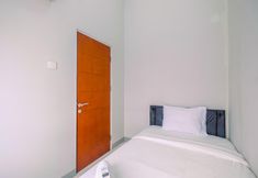 Bedroom 2 Homey and Chic 2BR Apartment at Taman Melati Margonda By Travelio