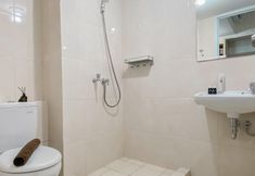 In-room Bathroom 6 Comfy and Well Furnished Studio at Springlake Summarecon Bekasi Apartment By Travelio