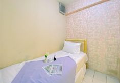 Bedroom 2 Homey and Comfortable 2BR Green Pramuka City Apartment By Travelio