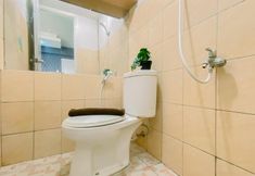 In-room Bathroom 6 Homey and Comfortable 2BR Green Pramuka City Apartment By Travelio