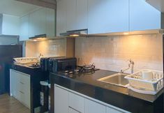 Ruang Umum 5 Good and Homey Studio at H Residence Apartment By Travelio