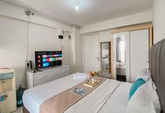 Bedroom 3 Chic and Best Strategic Studio at Bassura City Apartment By Travelio