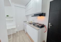 Common Space 6 Restful and Compact 2BR at Menara Rungkut Apartment By Travelio