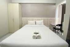 Bangunan Homey and Good Studio at The Alton Apartment By Travelio